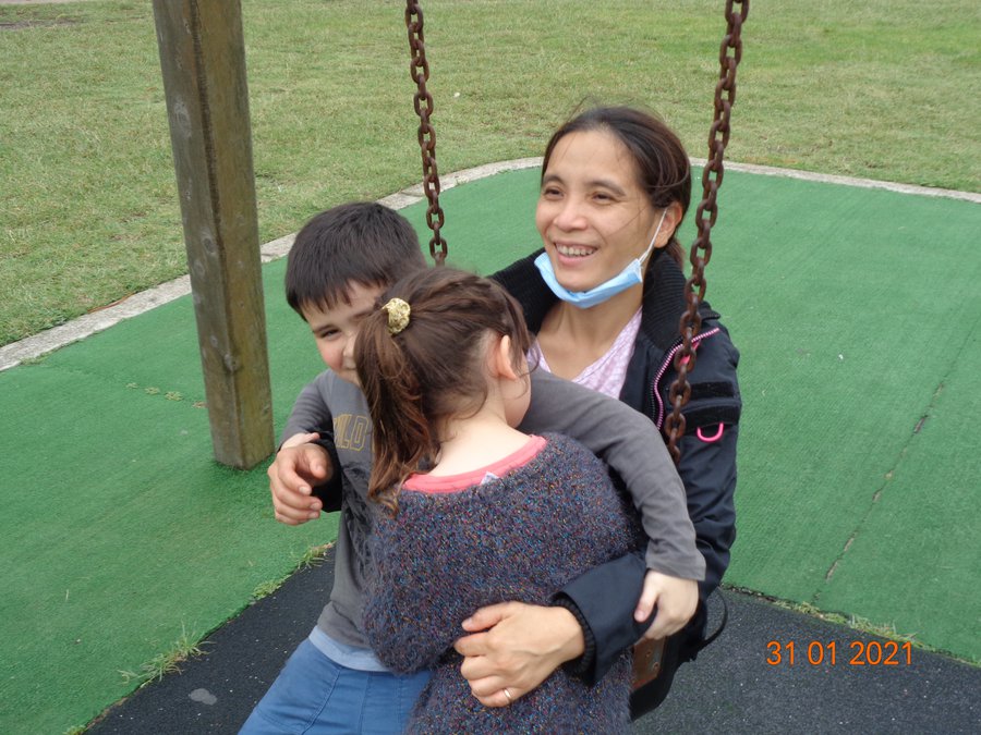 Gareth, Sophia and mum on swing